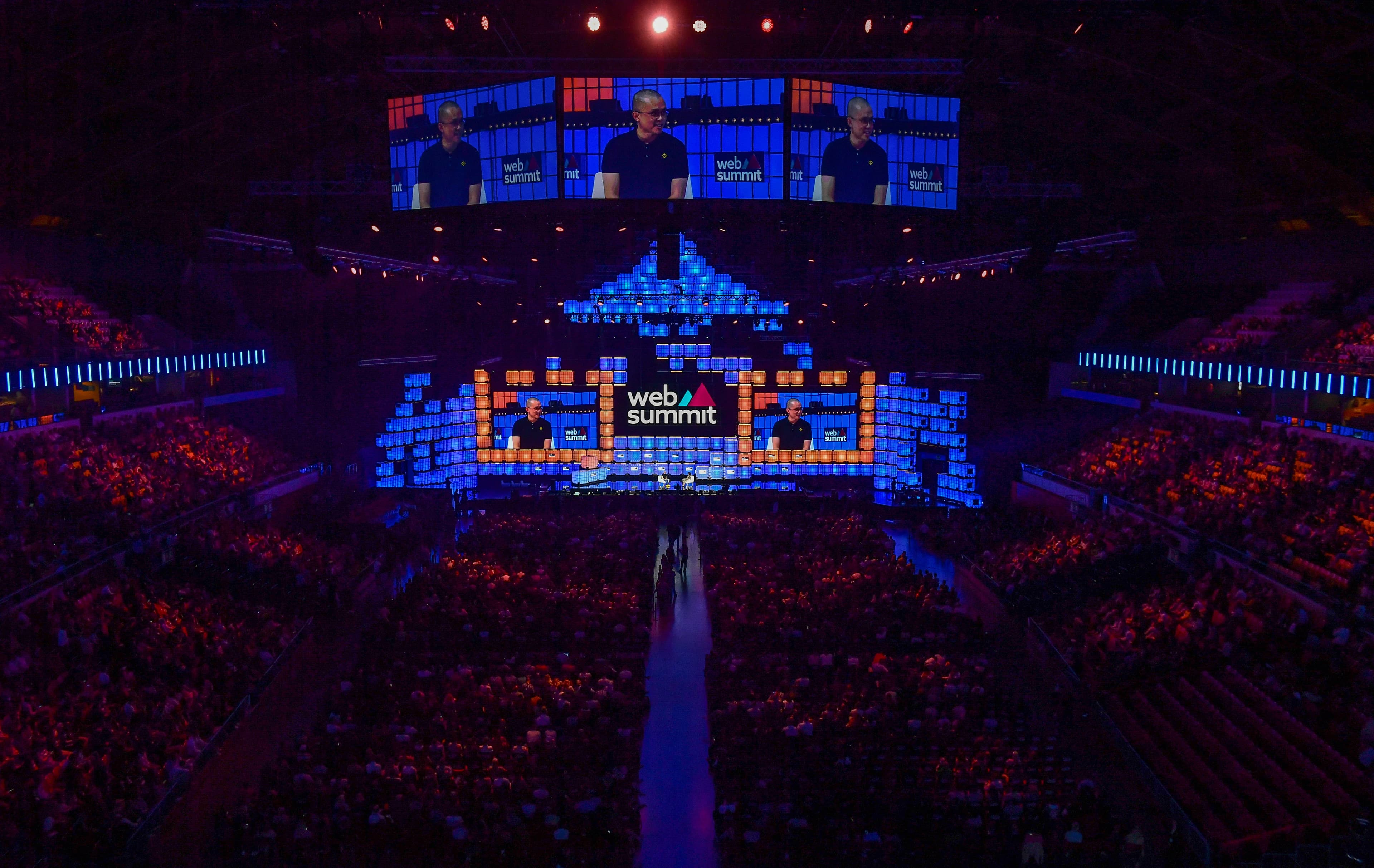 A wide view of Web Summit's opening night in Lisbon, with Binance co-founder Changpeng Zhao on the arena screens, November 1, 2022.