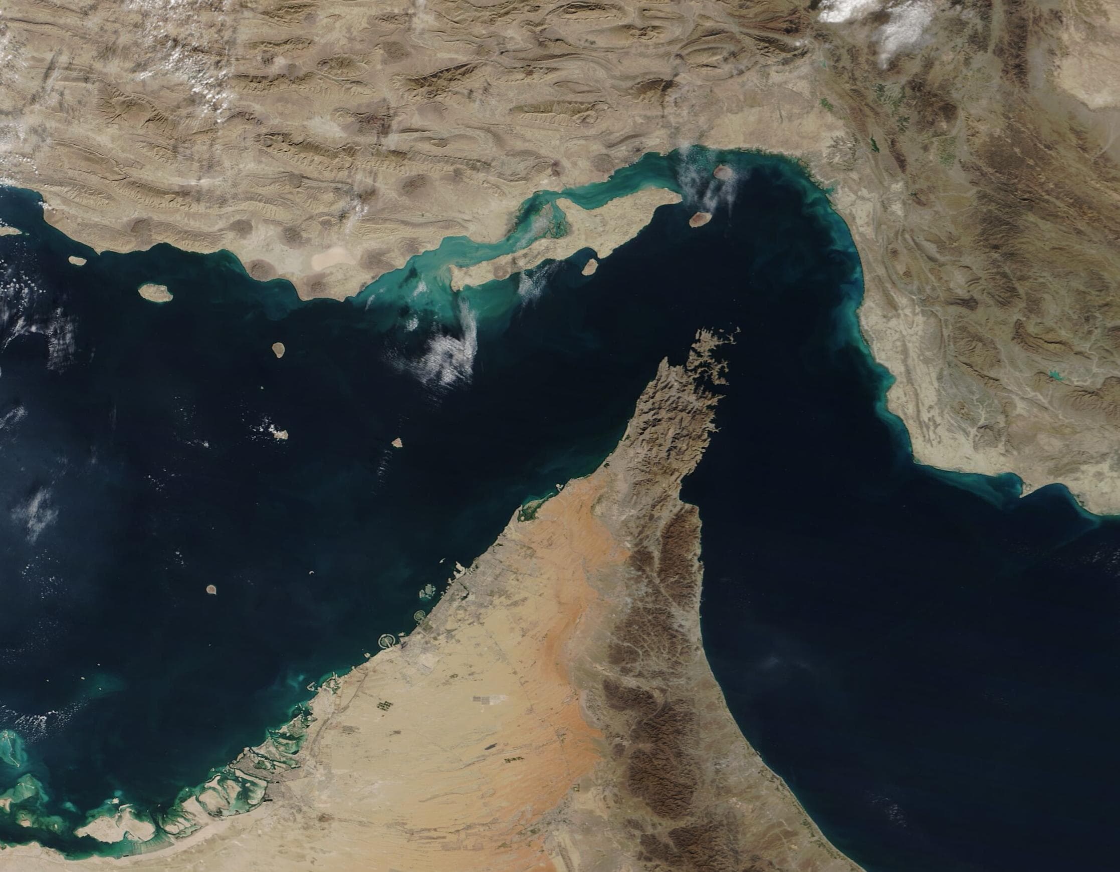 A true-color Terra/MODIS satellite image of the Strait of Hormuz, with Iran above and the Musandam Peninsula below, captured December 2, 2020.