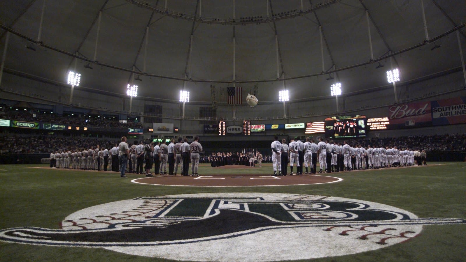 Players lined up on the field inside Tropicana Field in St. Petersburg, Florida, on Opening Day 2002.